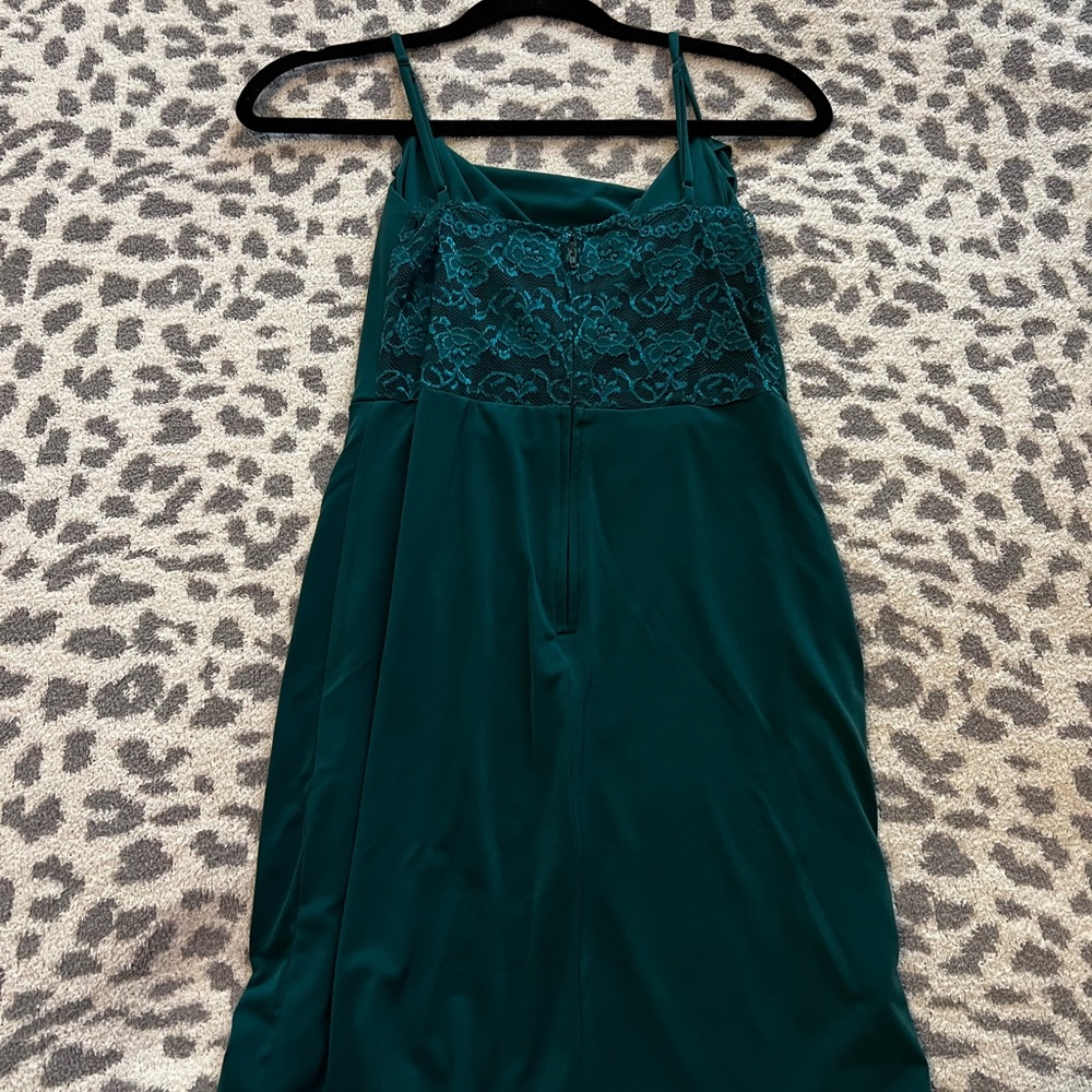 green mini dress with slit at bottom and lace back